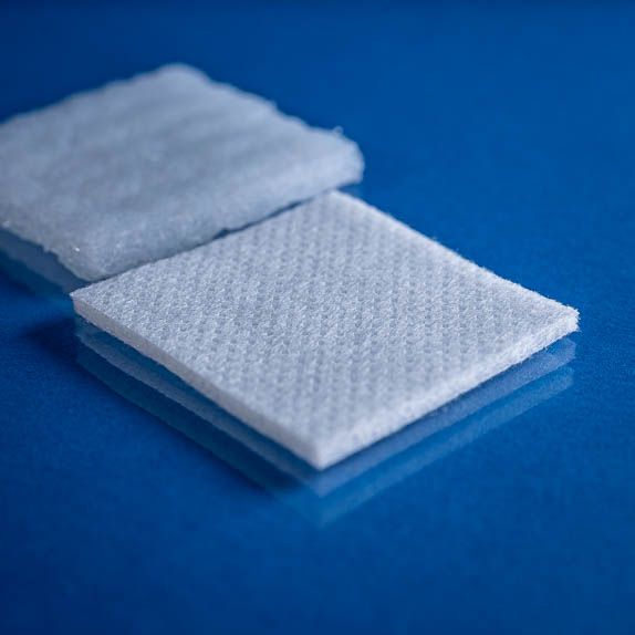 Type 2734 260gsm Washable Superabsorbent Needlepunch Nonwoven Fabric with top and bottom laminates shown close up