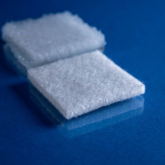 Type 7032 600gsm Superabsorbent Carded Needlepunch Nonwoven Fabric shown on a blue background close up