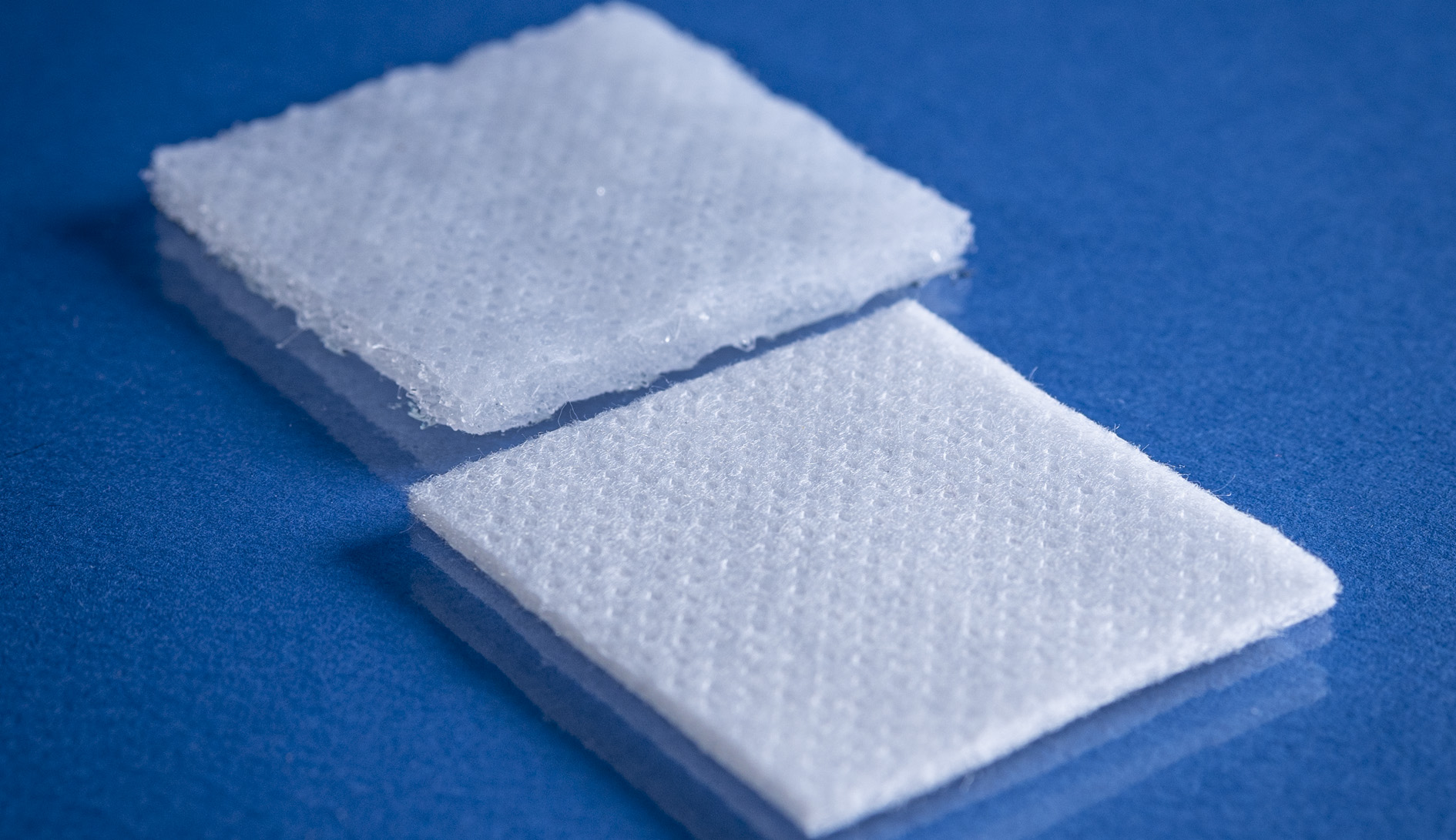 Type 9253 120gsm Superabsorbent Airlaid Fabric on a blue background